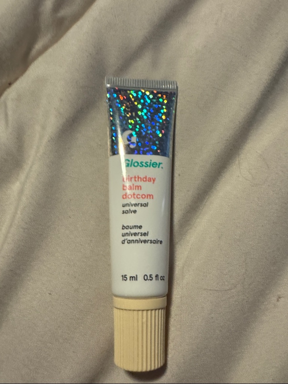Glossier Birthday Balm Dotcom - White Tube with Holographic in Birthday flavor